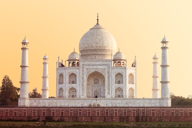 Majestic Taj Mahal against a clear blue sky.